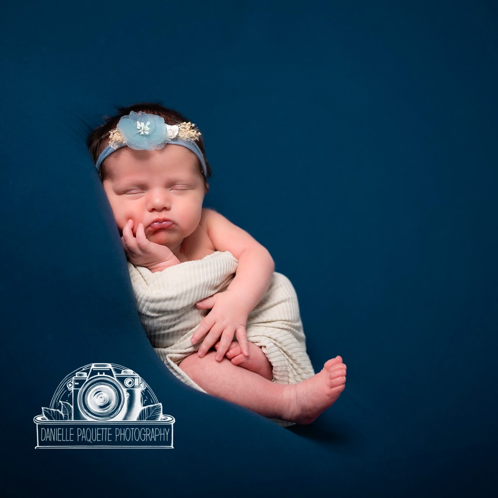 Richmond newborn baby on a serene blue backdrop